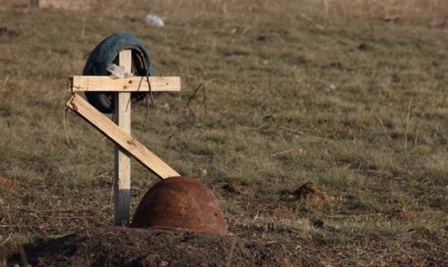 На Донеччині знайшли поховання жертв бойових дій 2014 року