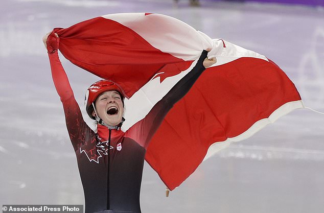 Кім Бутін з Канади святкує бронзову медаль у ковзанярстві (шорт-трек)