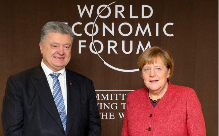 Зустріч Меркель і Порошенка у Давосі, фото — Твіттер П. Порошенка