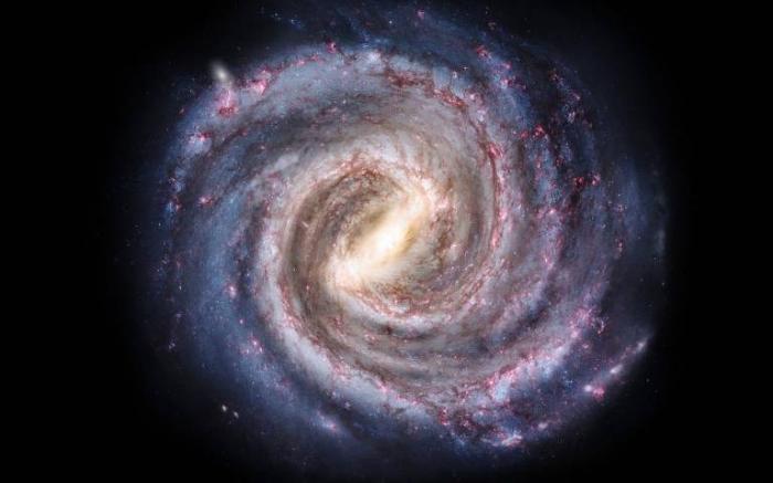 Уявлення художника про вигляд Чумацького шляху. Яскрава смуга у центрі зображення – галактичний бар. Фото: Університетський коледж Лондона